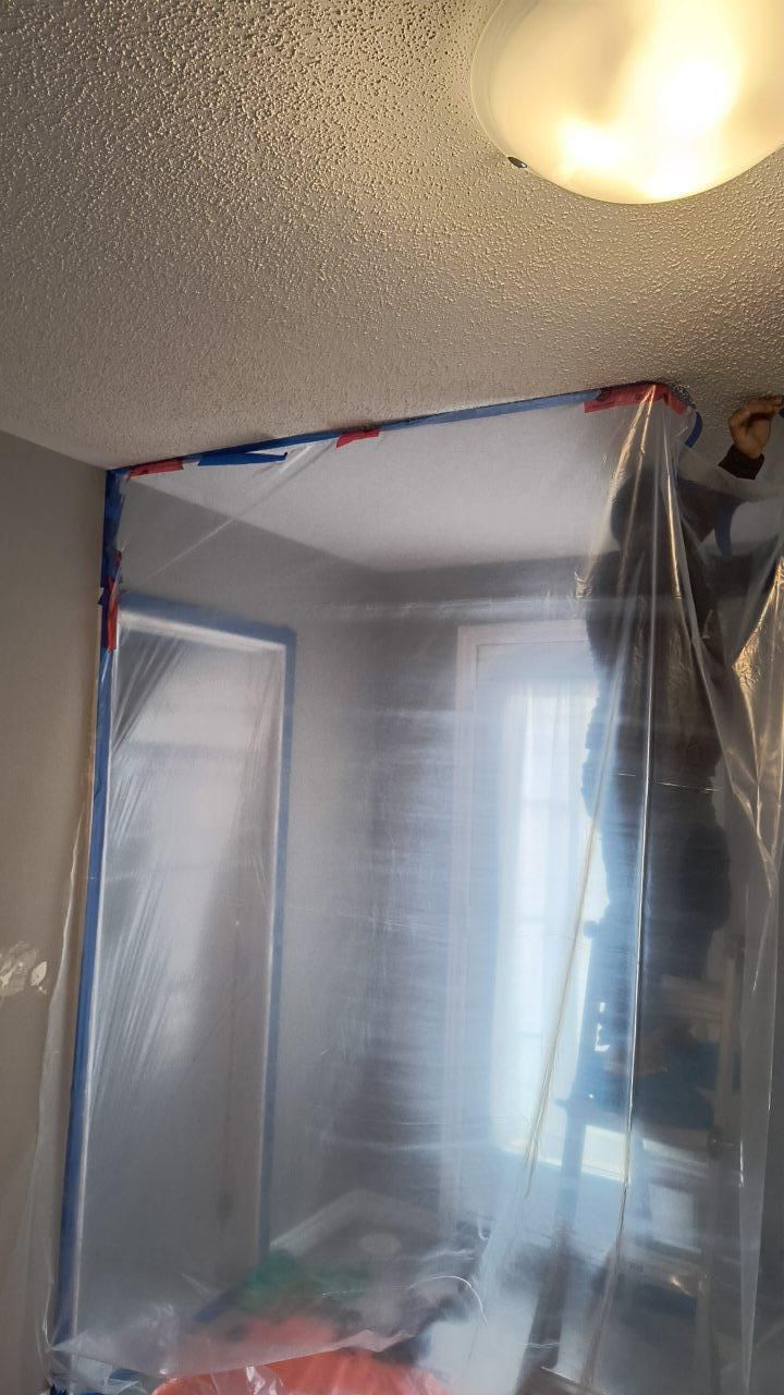 Balcony door mold remediation containment setup in Hamilton bedroom.