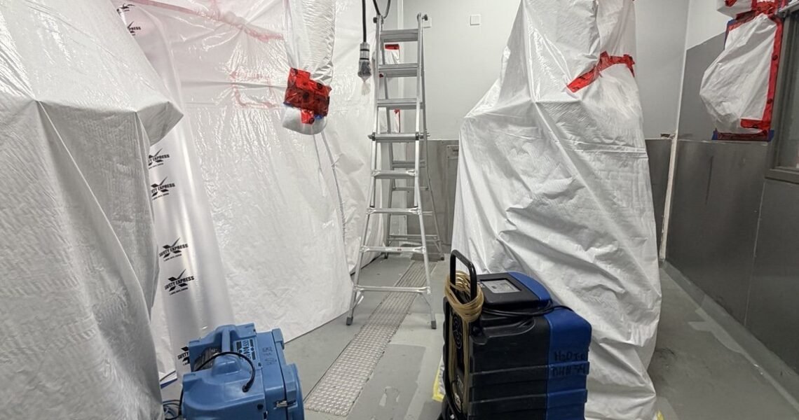 Protected equipment and HEPA air scrubbers inside containment